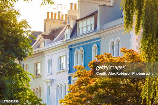colorful early 19th century townhouse buildings in notting hill - notting hill london stock pictures, royalty-free photos & images