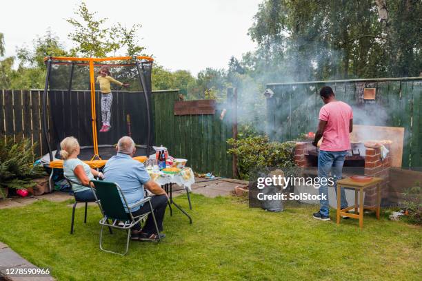 eating outdoors in summer - garden barbecue stock pictures, royalty-free photos & images