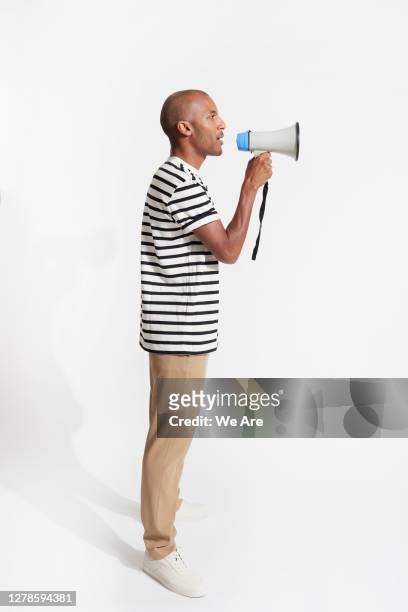 man talking into a megaphone - megaphone stock pictures, royalty-free photos & images
