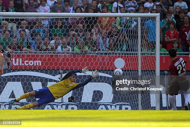 Mohammed Abdellaoue of Hannover scores the first goal by penalty against Sebastian Mielitz of Bremen during the Bundesliga match between Hanover 96...