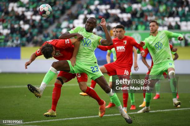 Tobias Strobl of FC Augsburg and Josuha Guilavogui of VfL Wolfsburg battle for possession during the Bundesliga match between VfL Wolfsburg and FC...