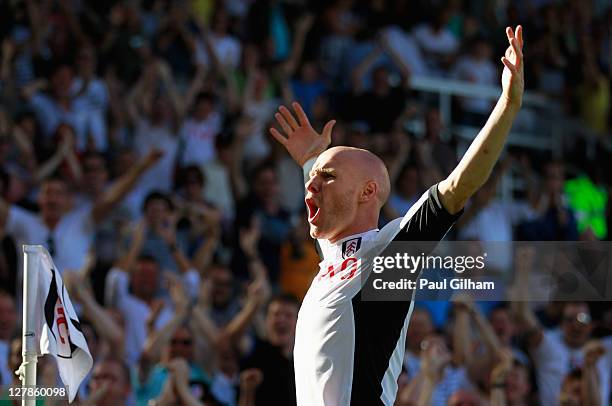 Andy Johnson of Fulham celebrates as he scores their first goal during the Barclays Premier League match between Fulham and Queens Park Rangers at...