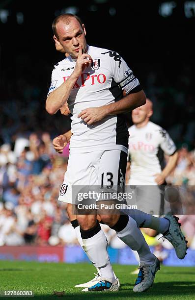 Danny Murphy of Fulham celebrates as he scores their second goal from the penalty spot during the Barclays Premier League match between Fulham and...