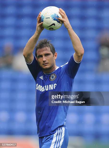 Frank Lampard of Chelsea celebrates with the match ball after scoring a hat-trick during the Barclays Premier League match between Bolton Wanderers...