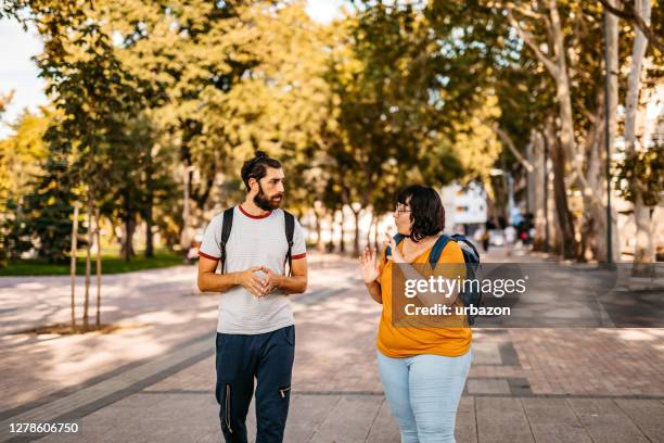 two young people speak in sign language - how to say your beautiful in sign language stock pictures, royalty-free photos & images