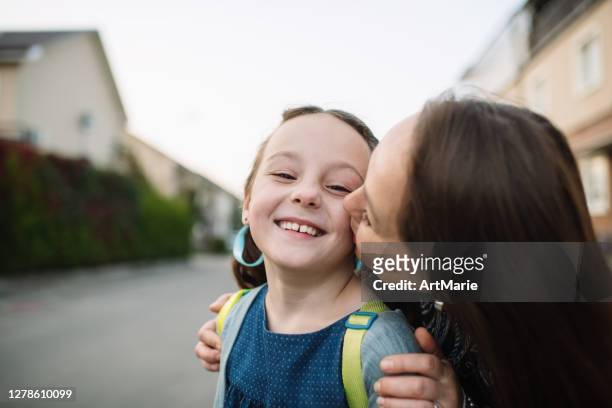 mother preparing to send her child back to school - kids leaving school stock pictures, royalty-free photos & images