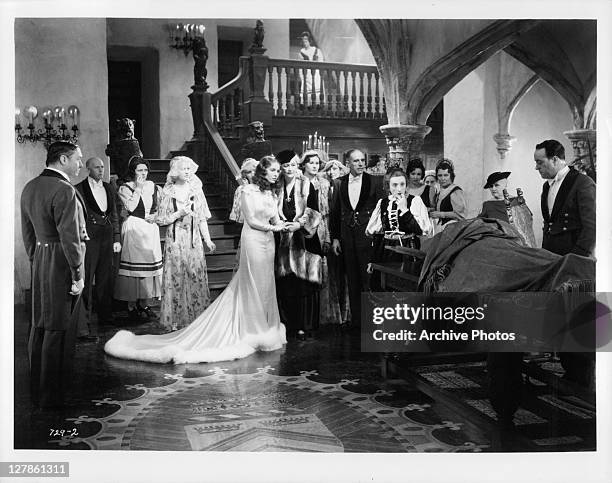 Valerie Hobson with astonished group as monster is revealed in a scene from the film 'Bride Of Frankenstein', 1935.