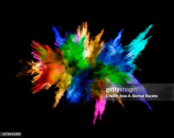 explosion by an impact of a cloud of particles of powder of multicolored on a black background. - colourful studio shots stockfoto's en -beelden