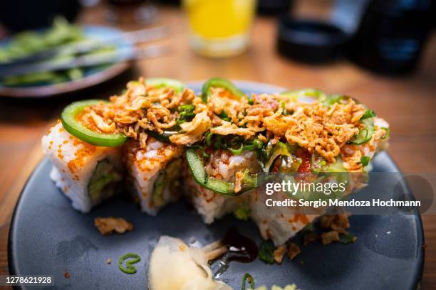 a top down view of a plate of sushi covered in panko with jalapeno peppers - mexico city, mexico - crunchy food stock pictures, royalty-free photos & images