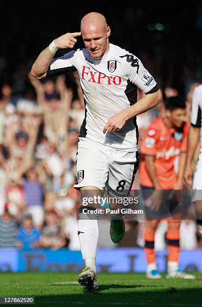 Andy Johnson of Fulham celebrates as he scores their third goal during the Barclays Premier League match between Fulham and Queens Park Rangers at...