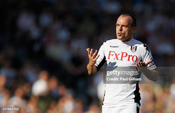 Danny Murphy of Fulham gestures during the Barclays Premier League match between Fulham and Queens Park Rangers at Craven Cottage on October 2, 2011...