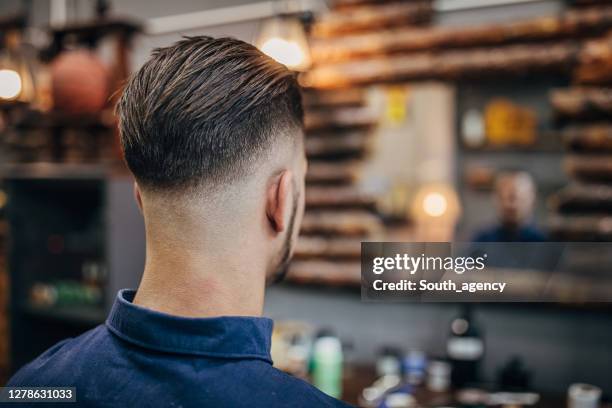 handsome man with modern haircut - man hairstyle stock pictures, royalty-free photos & images