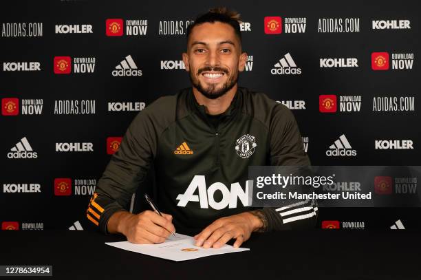 Alex Telles of Manchester United poses after signing for the club at Aon Training Complex on October 05, 2020 in Manchester, England.