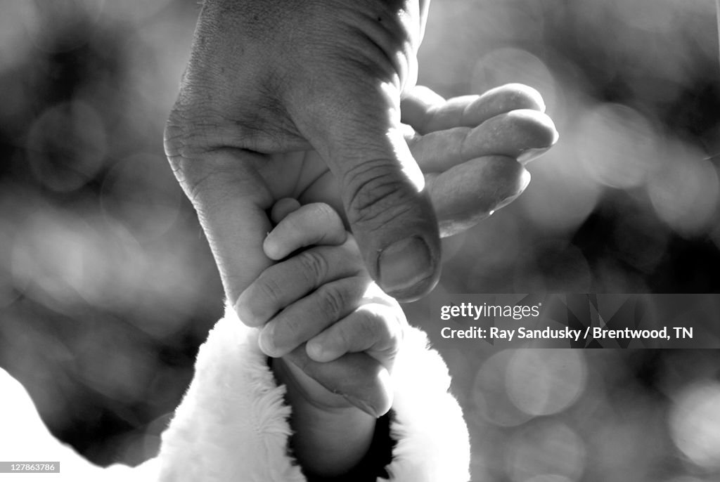 Child holding finger