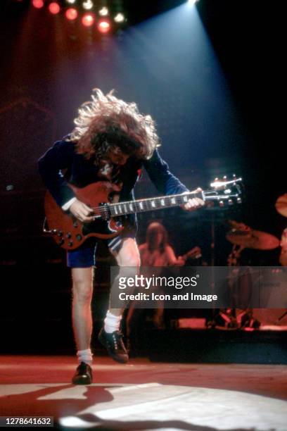 Angus Young, the Australian musician, best known as the co-founder, lead guitarist, and songwriter of the Australian hard rock band AC/DC, onstage at...
