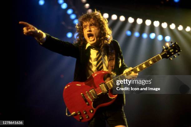 Angus Young, the Australian musician, best known as the co-founder, lead guitarist, and songwriter of the Australian hard rock band AC/DC, onstage at...