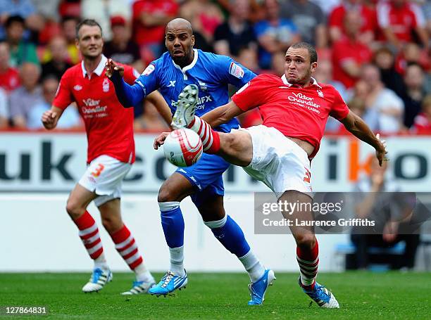 Joel Kyle of Nottingham Forest battles with Marlon King of Birmingham City during the npower Championship match between Nottingham Forest and...