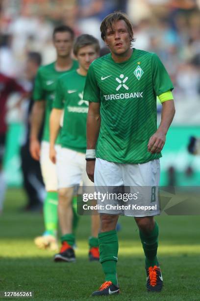 Clemens Fritz of Bremen looks dejected after losing 2-3 the Bundesliga match between Hanover 96 and SV Werder Bremen at AWD Arena on October 2, 2011...