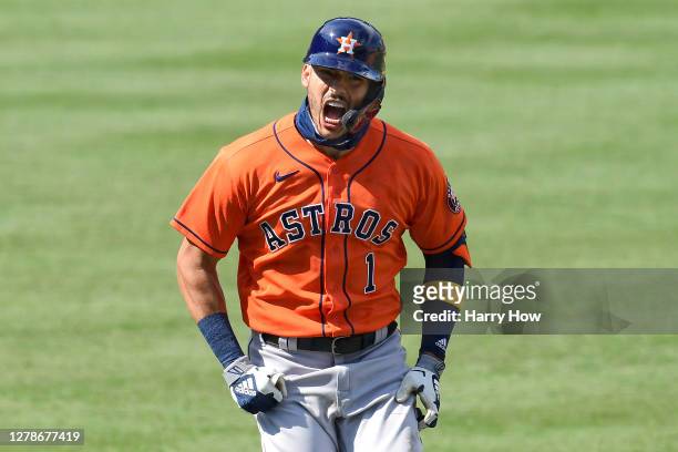 Carlos Correa of the Houston Astros celebrates after hitting a two run home run against the Oakland Athletics during the fourth inning in Game One of...
