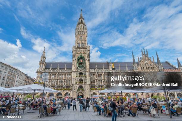 marienplatz and new town hall, tables and chairs on open space with catering by corona, munich, upper bavaria, bavaria, germany - marienplatz stock pictures, royalty-free photos & images