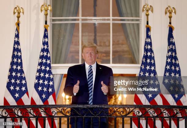 President Donald Trump gives a thumbs up upon returning to the White House from Walter Reed National Military Medical Center on October 05, 2020 in...