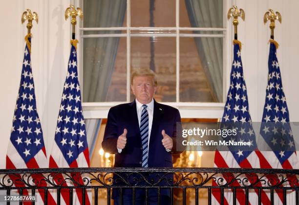 President Donald Trump gives a thumbs up upon returning to the White House from Walter Reed National Military Medical Center on October 05, 2020 in...