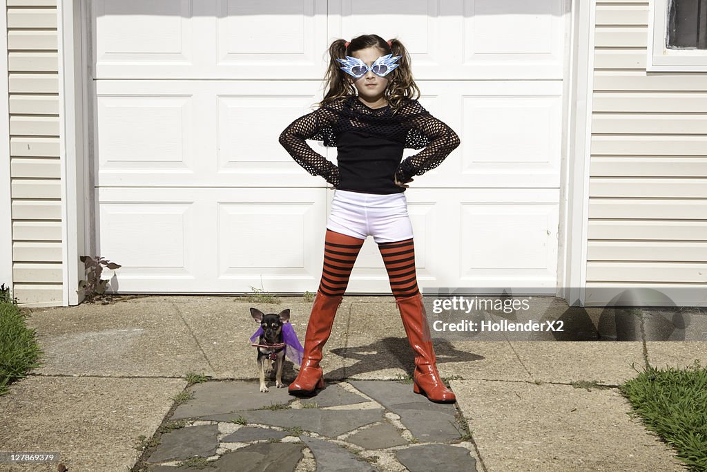 Girl and dog dressed in costumes