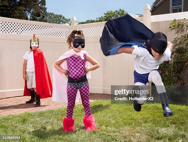 3 kids in superhero outfits - child superhero stock pictures, royalty-free photos & images