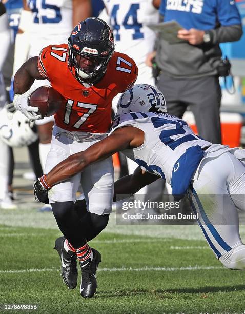 Anthony Miller of the Chicago Bears breaks a tackle by Kenny Moore II of the Indianapolis Colts at Soldier Field on October 04, 2020 in Chicago,...