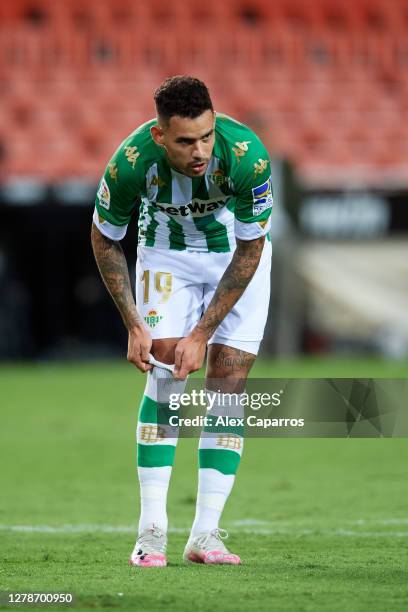 Antonio Sanabria of Real Betis adjusts his socks during the La Liga Santander match between Valencia CF and Real Betis at Estadio Mestalla on October...