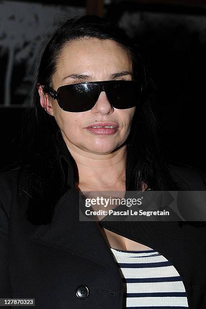 Beatrice Dalle attends the John Galliano Ready to Wear Spring / Summer 2012 show during Paris Fashion Week on October 2, 2011 in Paris, France.