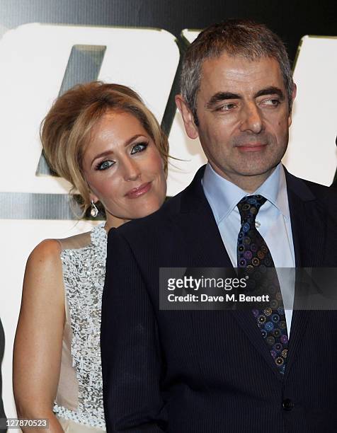 Gillian Anderson and Rowan Atkinson arrive at the UK Premiere of 'Johnny English Reborn' at Empire Leicester Square on October 2, 2011 in London,...