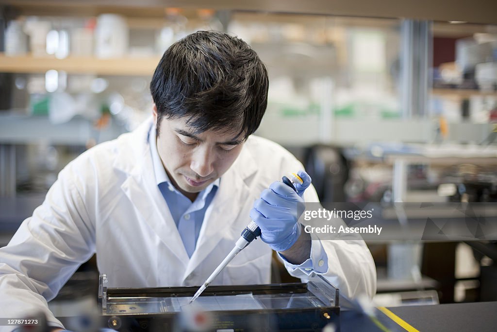 Laboratory technician uses micro-pipette