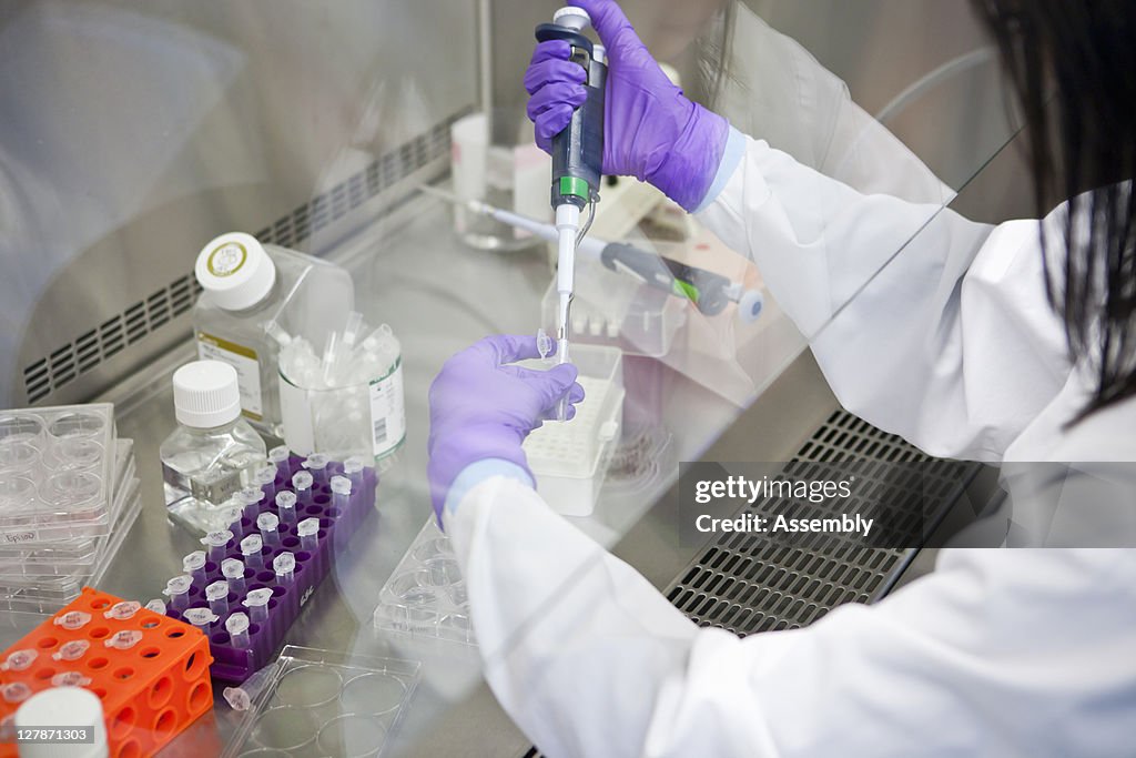Laboratory technician uses micro-pipette