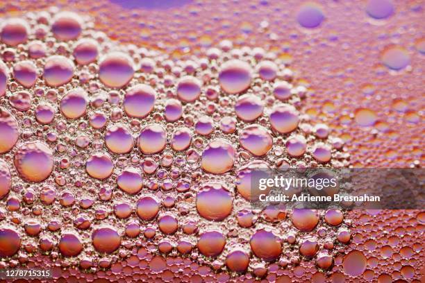 metallic pink bubbles - chemical reaction stock pictures, royalty-free photos & images