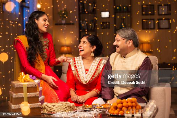 family diwali celebrate - stock photo - deepavali stock pictures, royalty-free photos & images