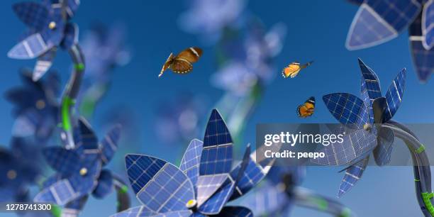 veel zonnepaneel bloemen genereren van duurzame energie in de buurt van vlinders - invention stockfoto's en -beelden