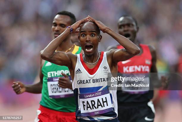 Mo Farah of Great Britain celebrates victory in the men's 5000m Final during the 2012 London Olympics at The Olympic Stadium on August 11, 2012 in...