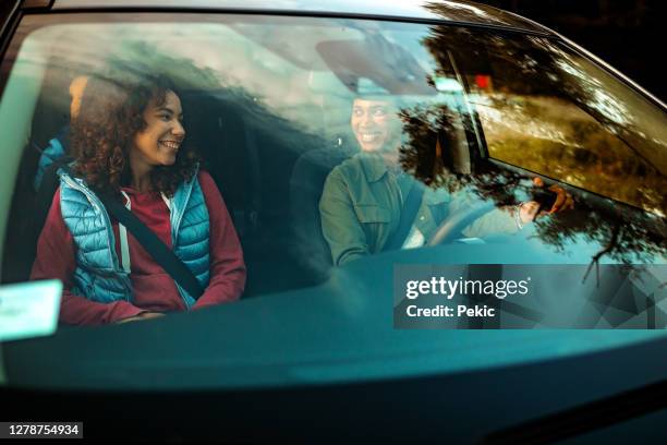 happy family sitting in the car - windscreen stock pictures, royalty-free photos & images