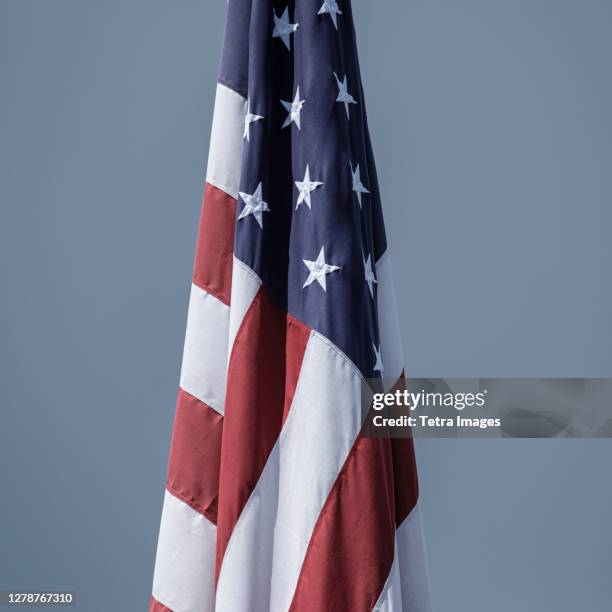 american flag on grey background - hanging flag stock pictures, royalty-free photos & images