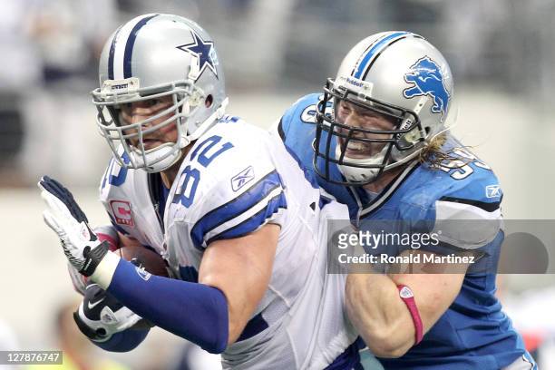 Jason Witten of the Dallas Cowboys carries the ball against Bobby Carpenter of the Detroit Lions during the second half at Cowboys Stadium on October...