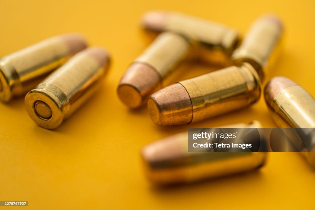 Brass bullets on yellow background