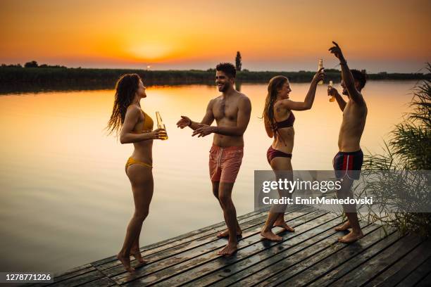 enjoying the moment on a pier by the lake - party on the pier stock pictures, royalty-free photos & images