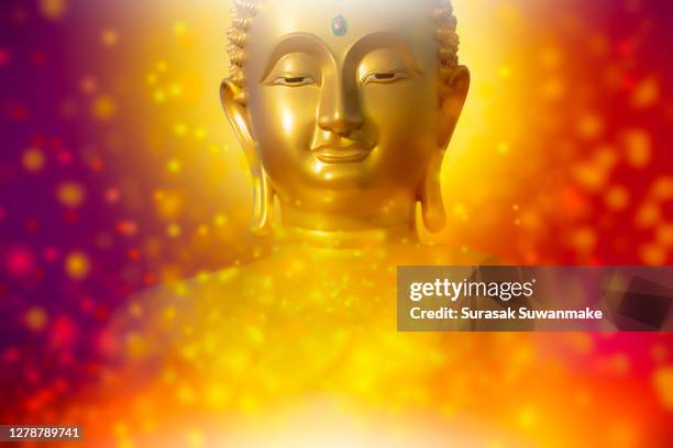 the lord buddha meditated gracefully on a lotus flower with an orange background. (about buddhism) - hindú stock-fotos und bilder