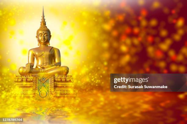 the lord buddha meditated gracefully on a lotus flower with an orange background. (about buddhism) - hindú stock-fotos und bilder