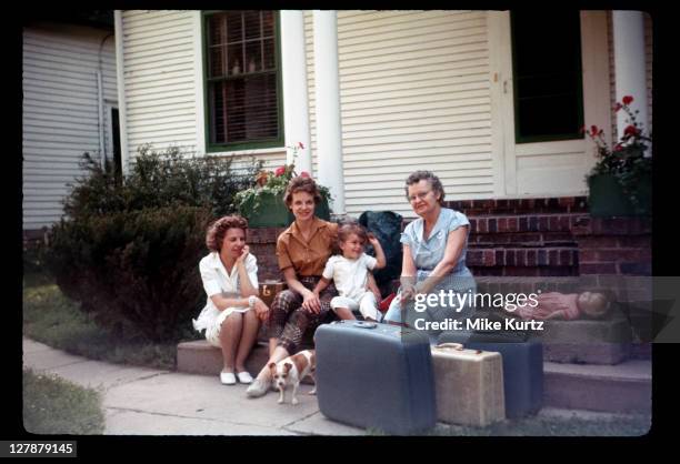 grandma visiting daughter and her family - archival image stock pictures, royalty-free photos & images