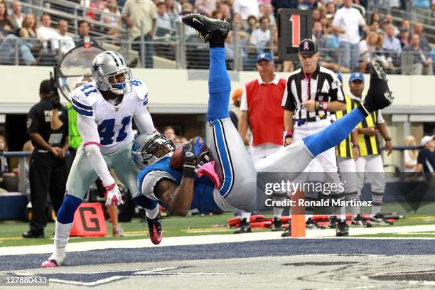 Calvin Johnson of the Detroit Lions catches a pass for a touchdown for the win over Terence Newman of the Dallas Cowboys at Cowboys Stadium on...