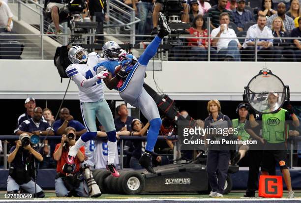 Calvin Johnson of the Detroit Lions pulls in the game-winning touchdown against Terence Newman of the Dallas Cowboys at Cowboys Stadium on October 2,...