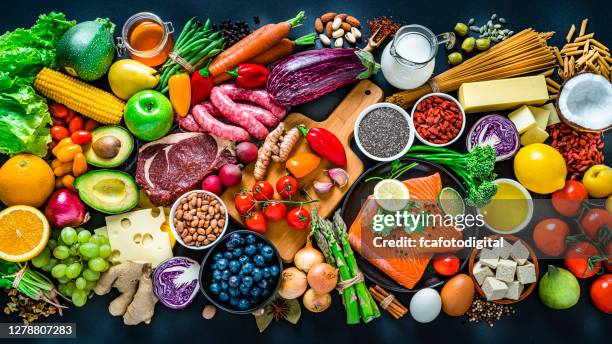 food and drink: carbohidrates, protein and dietary fiber shot from above on dark background. - still life not people imagens e fotografias de stock