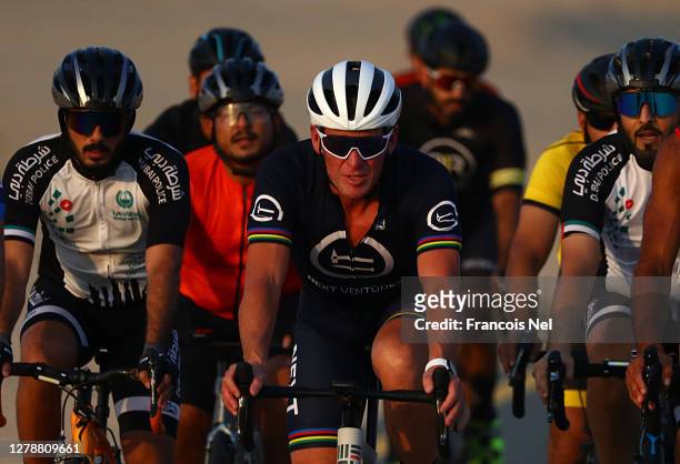 Lance Armstrong rides along cyclists during "Ride With Lance" at Al Qudra Cycling Track on October 06, 2020 in Dubai, United Arab Emirates.